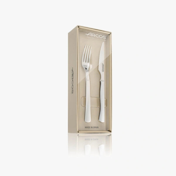 Juego Arcos Monoblock de 12 piezas con cuchillos chuleteros y tenedores de acero inoxidable.